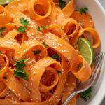 Carrot Ribbon Salad – The Best Fresh & Flavorful Recipe to Try Now 2 carrot ribbon salad with sesame lime dressing on rustic wooden table