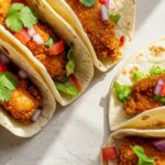 Crispy Air Fryer Fish Taco Recipe : Delicious, Healthy, And Easy To Make In Minutes! 13 Recipe card for air fryer fish tacos next to a beautifully plated dish, with natural daylight highlighting both.